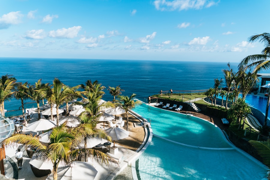 A peaceful resort pool framed by palm trees